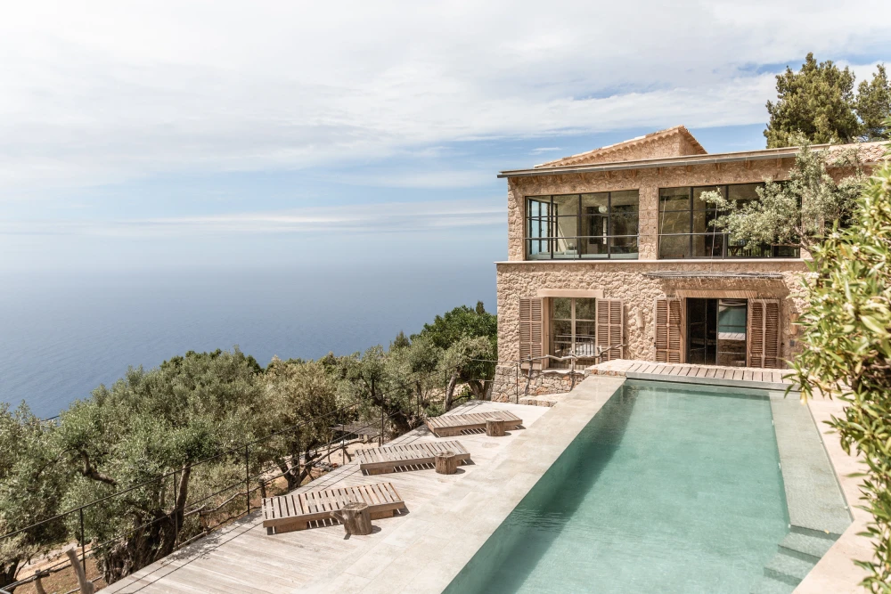 Image of Mallorca property showcasing an outdoor pool with a view of the ocean